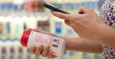 photo of person scanning qr code on an item with their smart phone